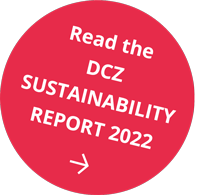 Red circle with light text reading: Read the DCZ sustainability report 2022
